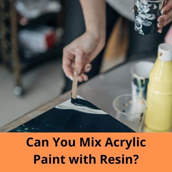 painting using a popsicle stick to a canvas